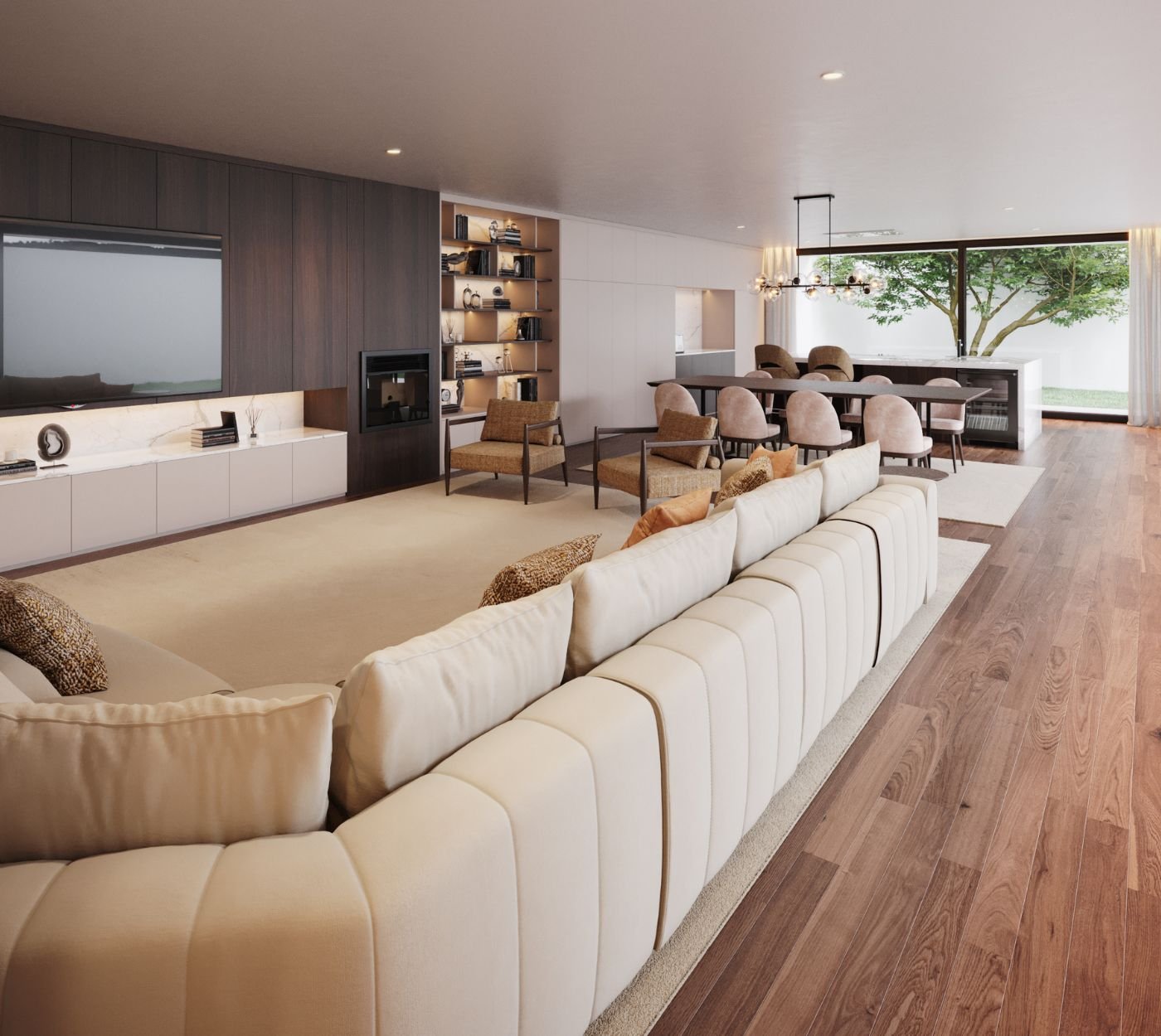 Um projeto de interior design pensado para uma atmosfera acolhedora, onde a decoração sala integra um espaçoso sofá modular em tons claros no centro deste open space.