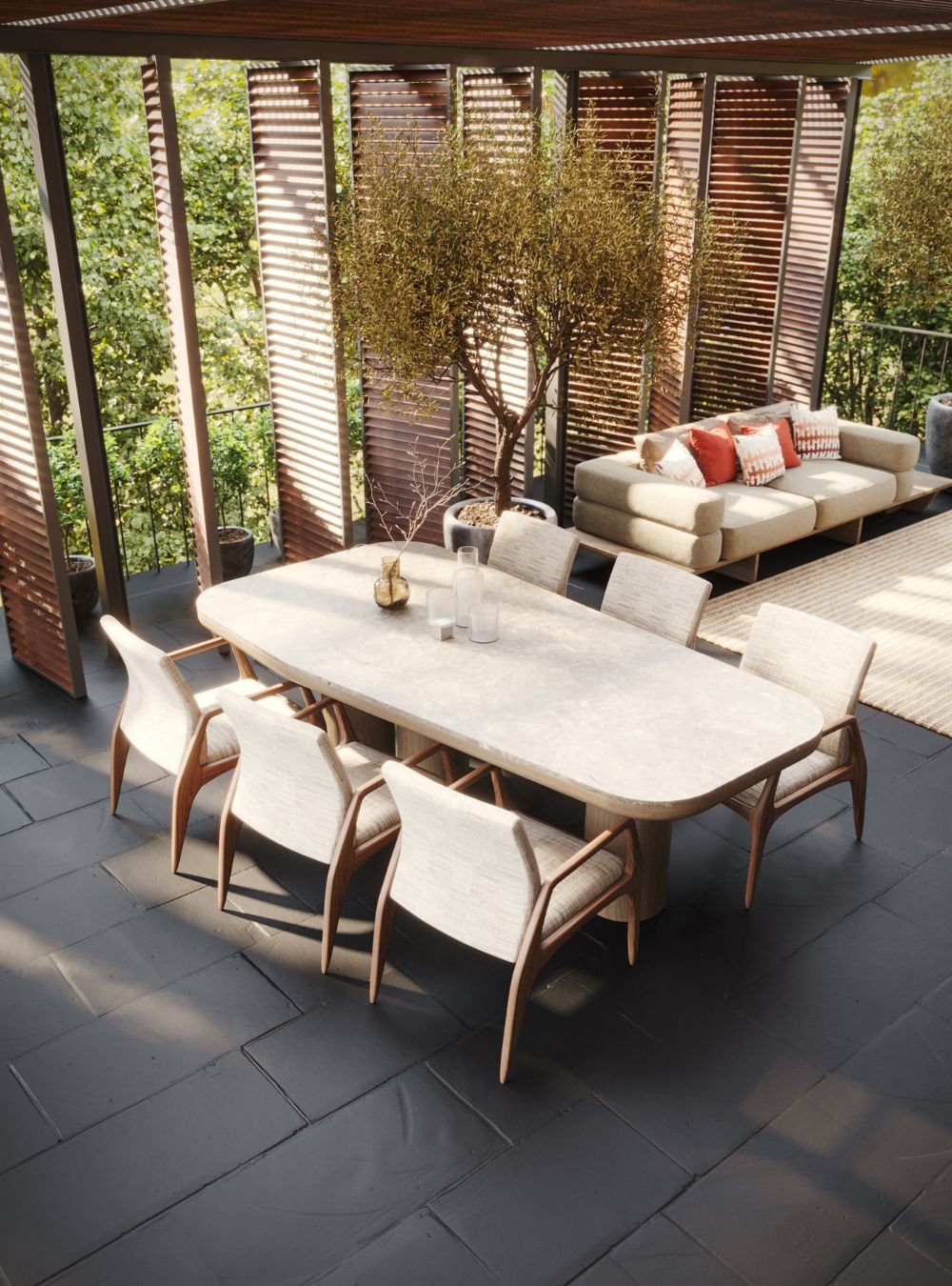 Mesa de refeições e sofá integrados num pátio privado. Um serviço de design de interiores focado em decoração e mobiliário de exterior para inspirar casas modernas.