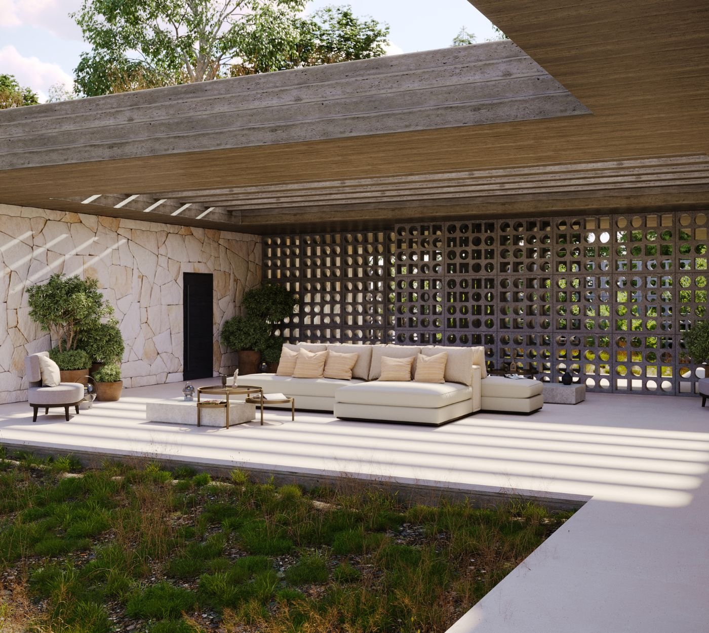Pátio exterior amplo com parede em pedra rústica e zona lounge moderna, ilustrando mobiliário de jardim requintado sob medida para serviços de decoração e o design de interiores de casas modernas.